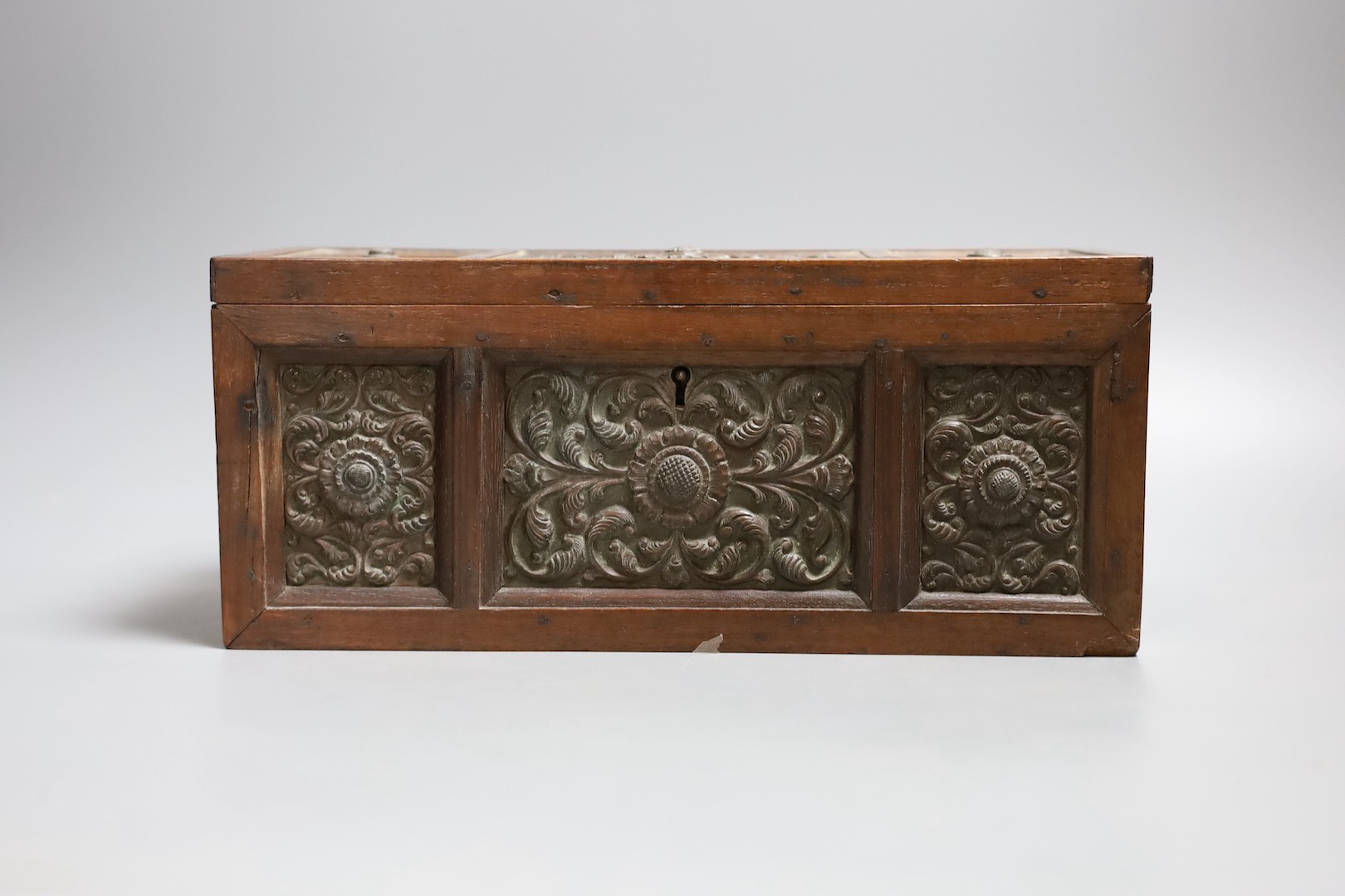 A carved wood panelled box, stamped The Madras School of Art, with label dated 1897, 29cm